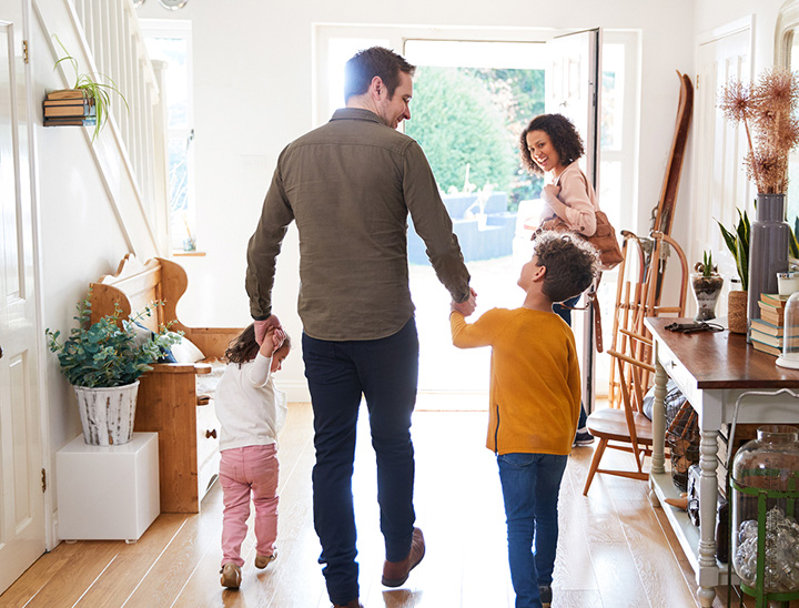 Image of a young family in their new home